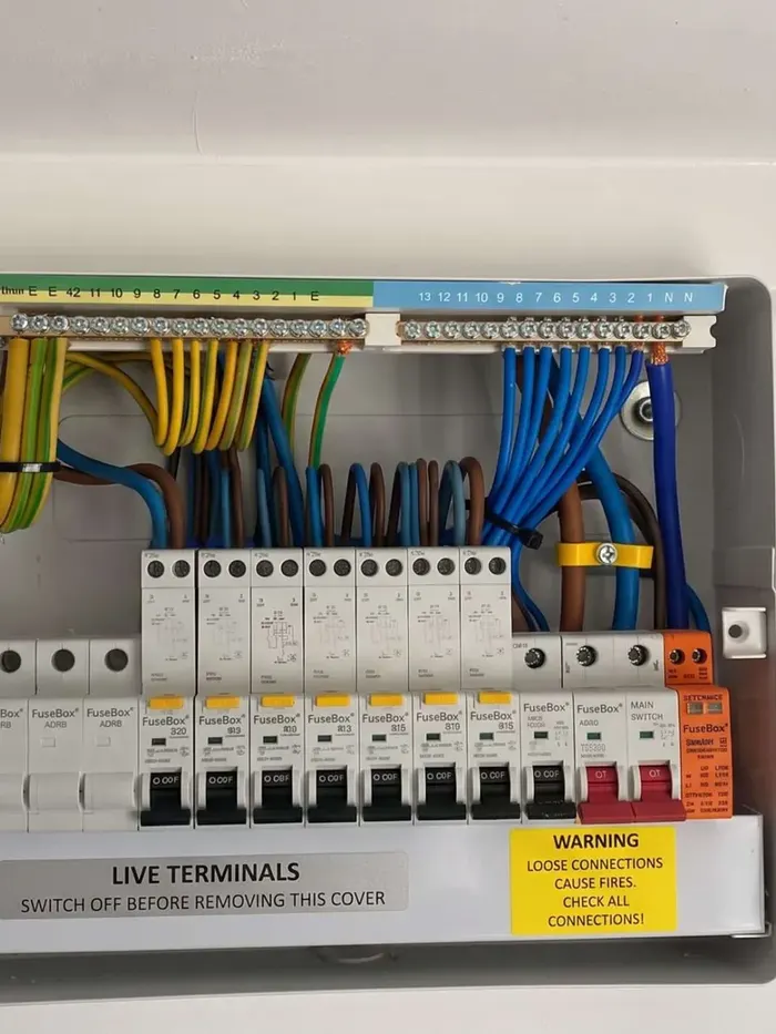 Close-up of a modern UK consumer unit with the cover removed