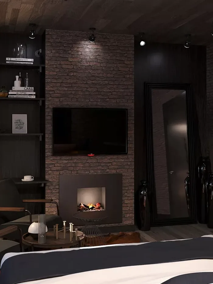 Dark lounge with a fireplace, shelving and a lamp